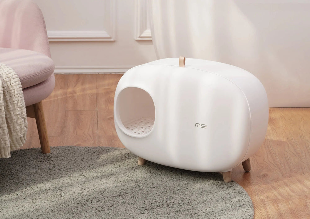 Witte design kattenbak in de woonkamer