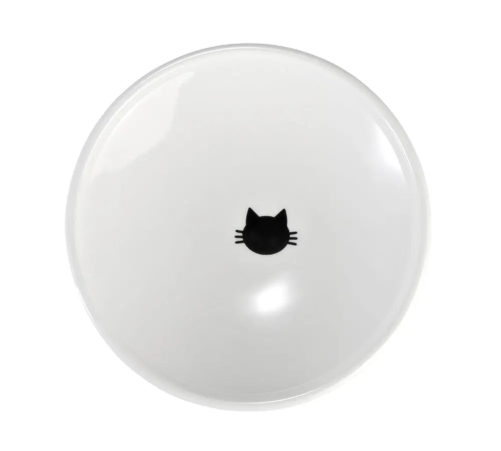 Kattenkopje onderin de witte kom